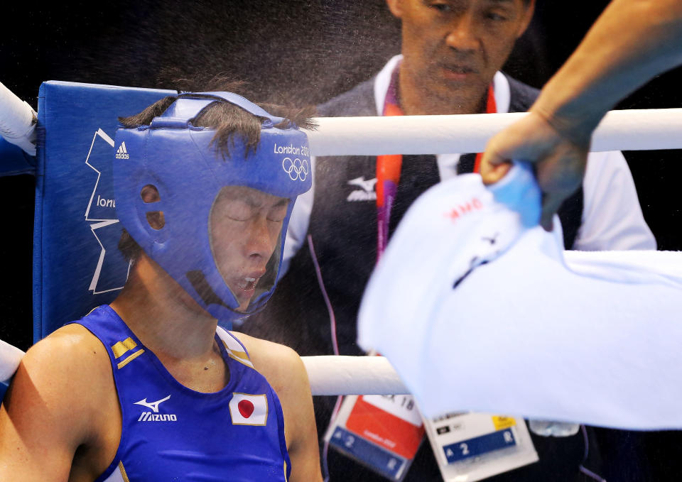 LONDON, ENGLAND - AUGUST 05: Satoshi Shimizu of Japan sits in his corner during his bout with Mohamed Amine Ouadahi of Algeria during the Men's Bantam (56kg) Boxing on Day 9 of the London 2012 Olympic Games at ExCeL on August 5, 2012 in London, England. (Photo by Scott Heavey/Getty Images)