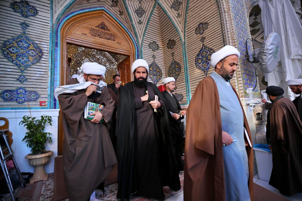 In this Sunday, Feb. 2, 2020, Shiite seminary students take a break between lectures at "Hawza" seminary, in the holy shrine of Imam Ali, the son-in-law, and cousin of the Prophet Muhammad and the first Imam of the Shiites, in Najaf, Iraq. Grand Ayatollah Ali al-Sistani, Iraq’s top Shiite cleric, turns 90 this year, and when he recently had surgery it sent chills around the country and beyond. What happens when al-Sistani is gone? Iran is likely to try to exploit the void to gain followers among Iraq’s Shiites. Standing in its way is the Hawza, the centuries-old institution of religious learning which al-Sistani heads and which follows its own tradition-bound rules. (AP Photo/Hadi Mizban)