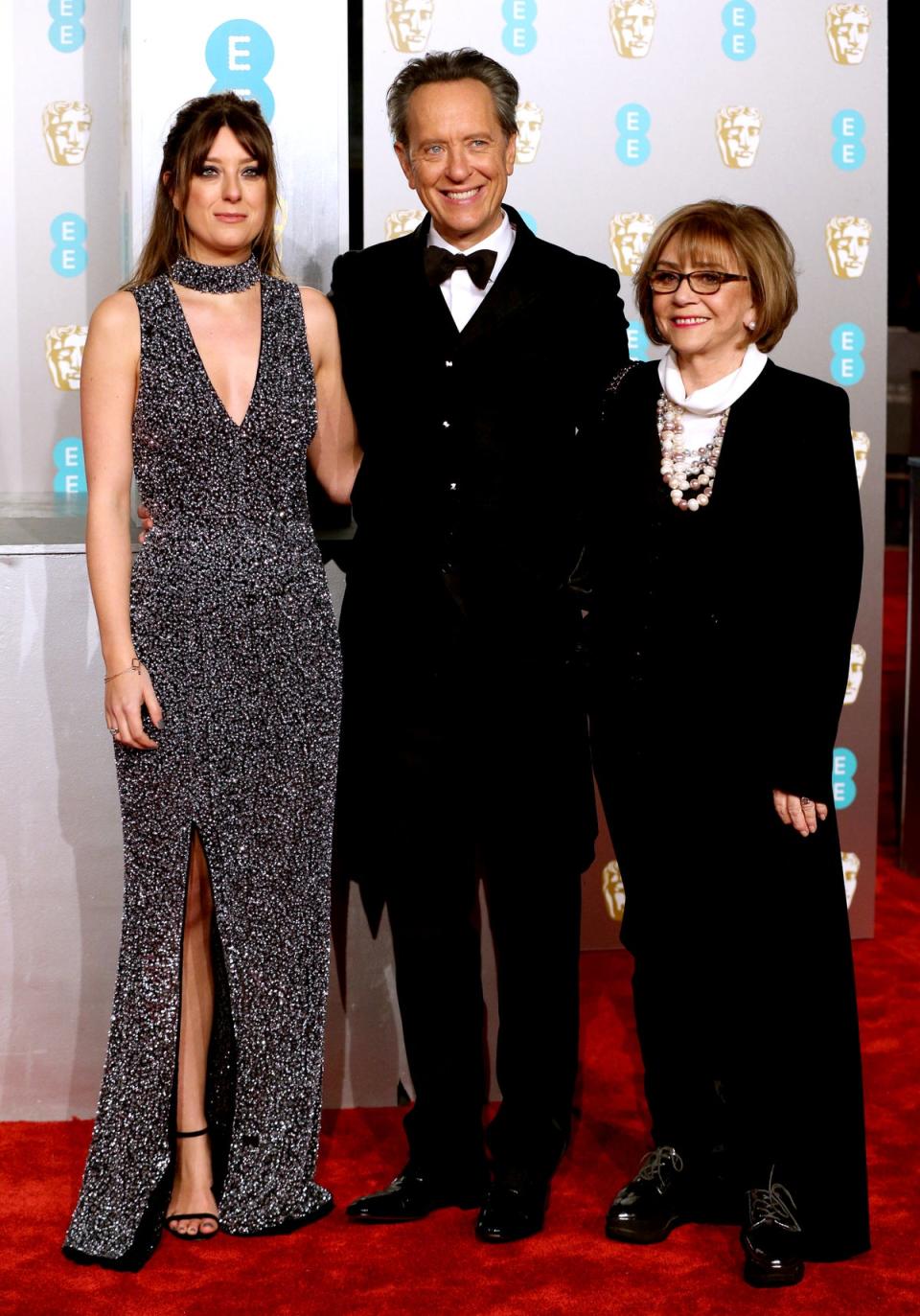 The actor and his late wife with their daughter Olivia (PA Archive)