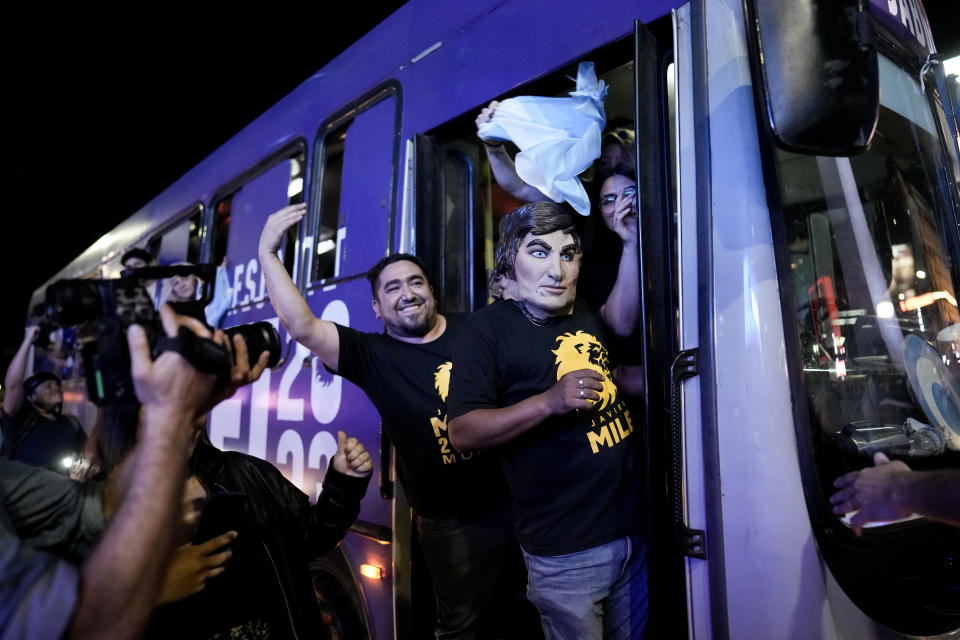 Supporters of Javier Milei, candidate of the Liberty Advances coalition, celebrate his victory over Sergio Massa, the Economy Minister and candidate of the Peronist party, in the presidential runoff election in Buenos Aires, Argentina, Sunday, Nov. 19, 2023. (AP Photo/Rodrigo Abd)