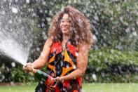 <p>Winner of the 2021 Australian Open Naomi Osaka sprays champagne during a photo shoot at the Government House in Melbourne on Sunday.</p>