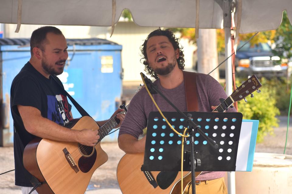 Musicians Joe Jeffrey, left, of Plymouth and Ed Jeffrey of Blissfield perform the song "Take Me Home, Country Roads" Oct, 10, 2021, at Tecumseh's Appleumpkin Festival. Live music will again be featured at this year's festival, which is Saturday and Sunday, Oct. 8-9, 2022.