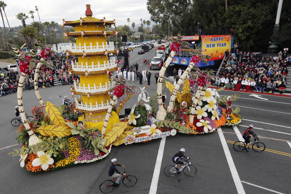 The "Cycling Through Paradise" float from China Airlines, winner of the International trophy for the most beautiful entry from outside the United States, appears in the 124th Rose Parade in Pasadena, Calif., Tuesday, Jan. 1, 2013. (AP Photo/Patrick T. Fallon)