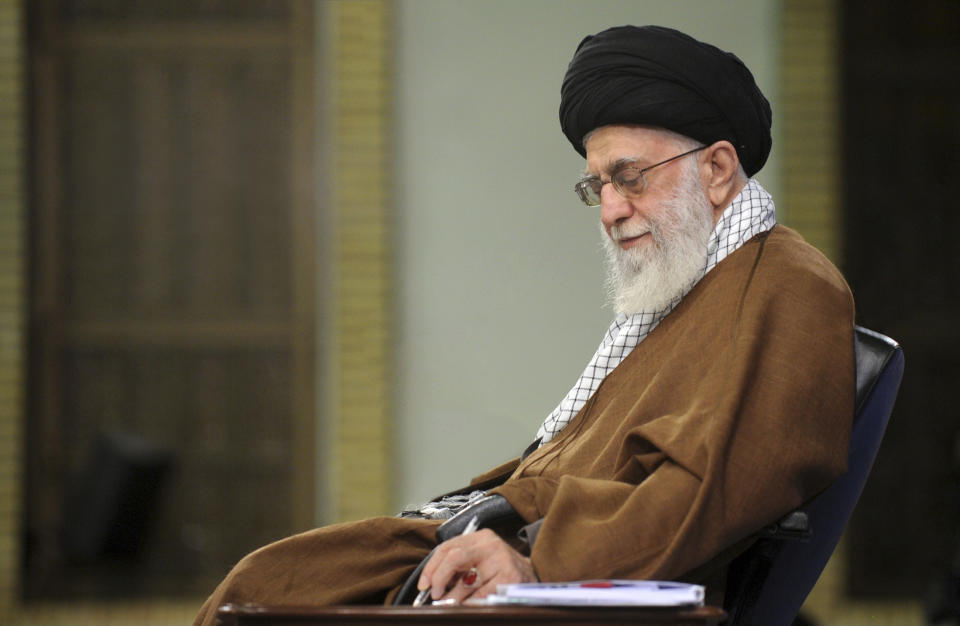 In this picture released on Jan. 12, 2019, by the official website of the office of the Iranian supreme leader, Supreme Leader Ayatollah Ali Khamenei takes notes during a meeting in Tehran, Iran. In a statement released on Wednesday Feb. 13, Iran's supreme leader said negotiations with the U.S. "will bring nothing but material and spiritual harm" — remarks that come ahead of an American-led meeting on the Mideast in Warsaw. (Office of the Iranian Supreme Leader via AP)
