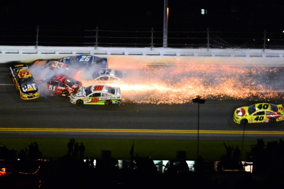 Feb 23, 2014 file photo; Daytona Beach, FL, USA; NASCAR Sprint Cup drivers Ryan Newman (31), Austin Dillon (3), Cole Whitt (26), Parker Kligerman (30), Terry Labonte (32) wreck during the Daytona 500 at Daytona International Speedway. Mandatory Credit: Andrew Weber-USA TODAY Sports (TPX IMAGES OF THE DAY SPORT)