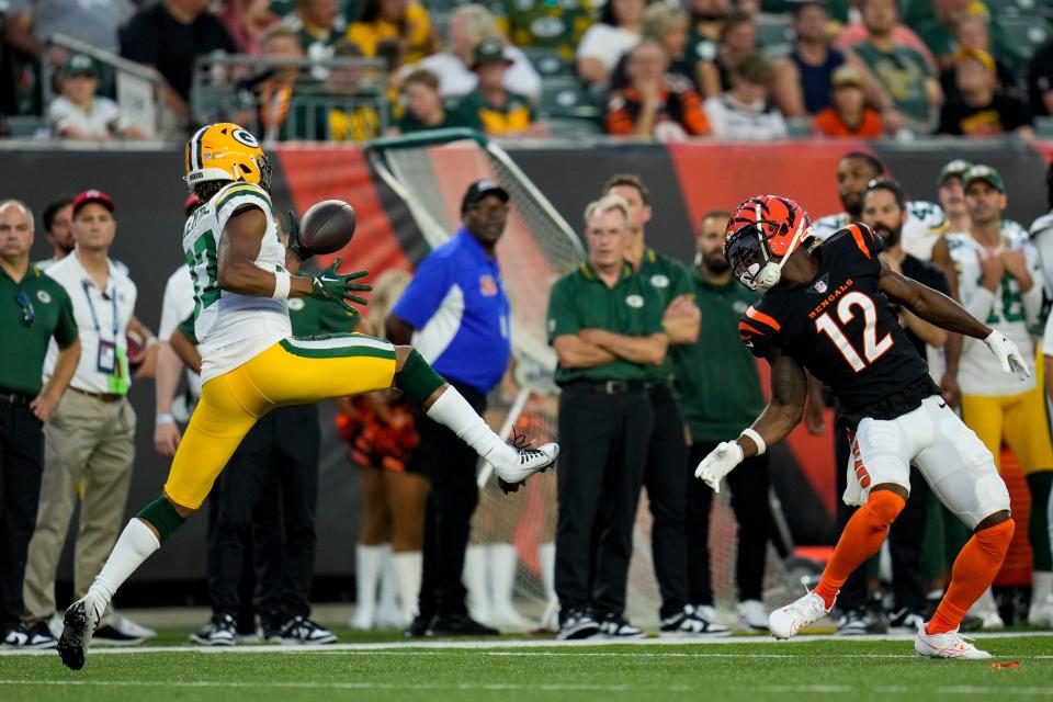 Green Bay Packers cornerback Carrington Valentine (37) intercepts a pass intended for Cincinnati Bengals wide receiver Shedrick Jackson (12) in the second quarter of the NFL Preseason Week 1 game between the Cincinnati Bengals and the Green Bay Packers at Paycor Stadium in downtown Cincinnati on Friday, Aug. 11, 2023. The Packers led 21-16 at halftime.