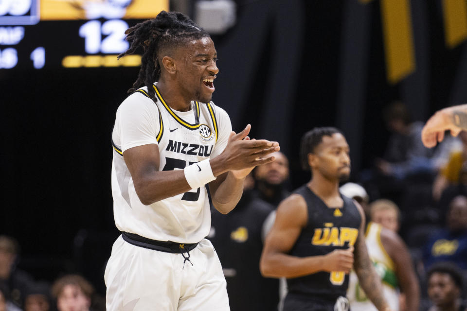 Sean East II celebrates a three point basket during the first half of an NCAA college basketball game against Arkansas-Pine Bluff Monday, Nov. 6, 2023, in Columbia, Mo. (AP Photo/L.G. Patterson)