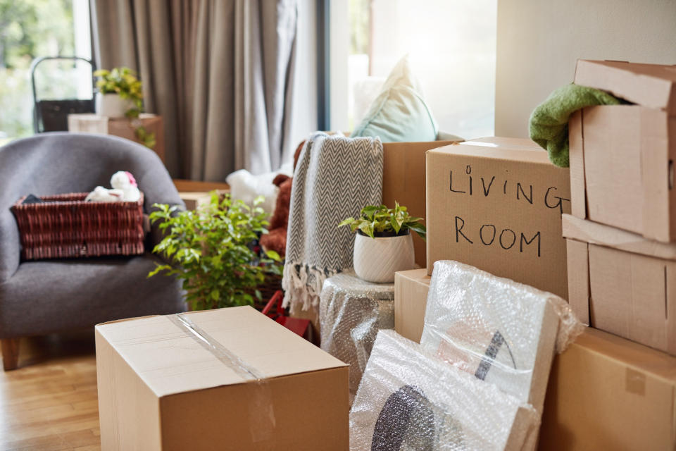 A living room full of moving boxes