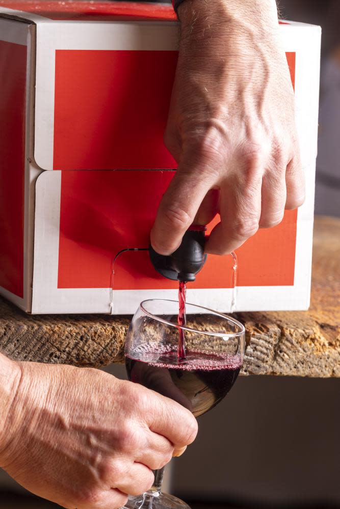 pouring red wine from a boxPouring red wine from a box.