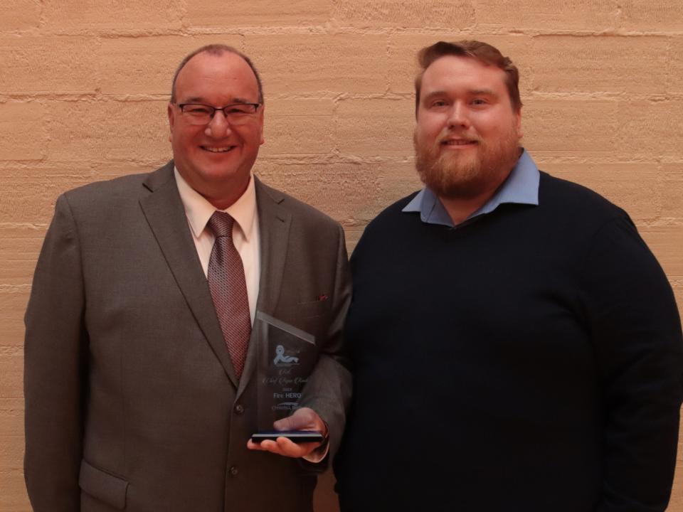 2023 Fire Hero Ryan Rank, left, is pictured with award presenter Aaron Treadway of Comerica Bank.