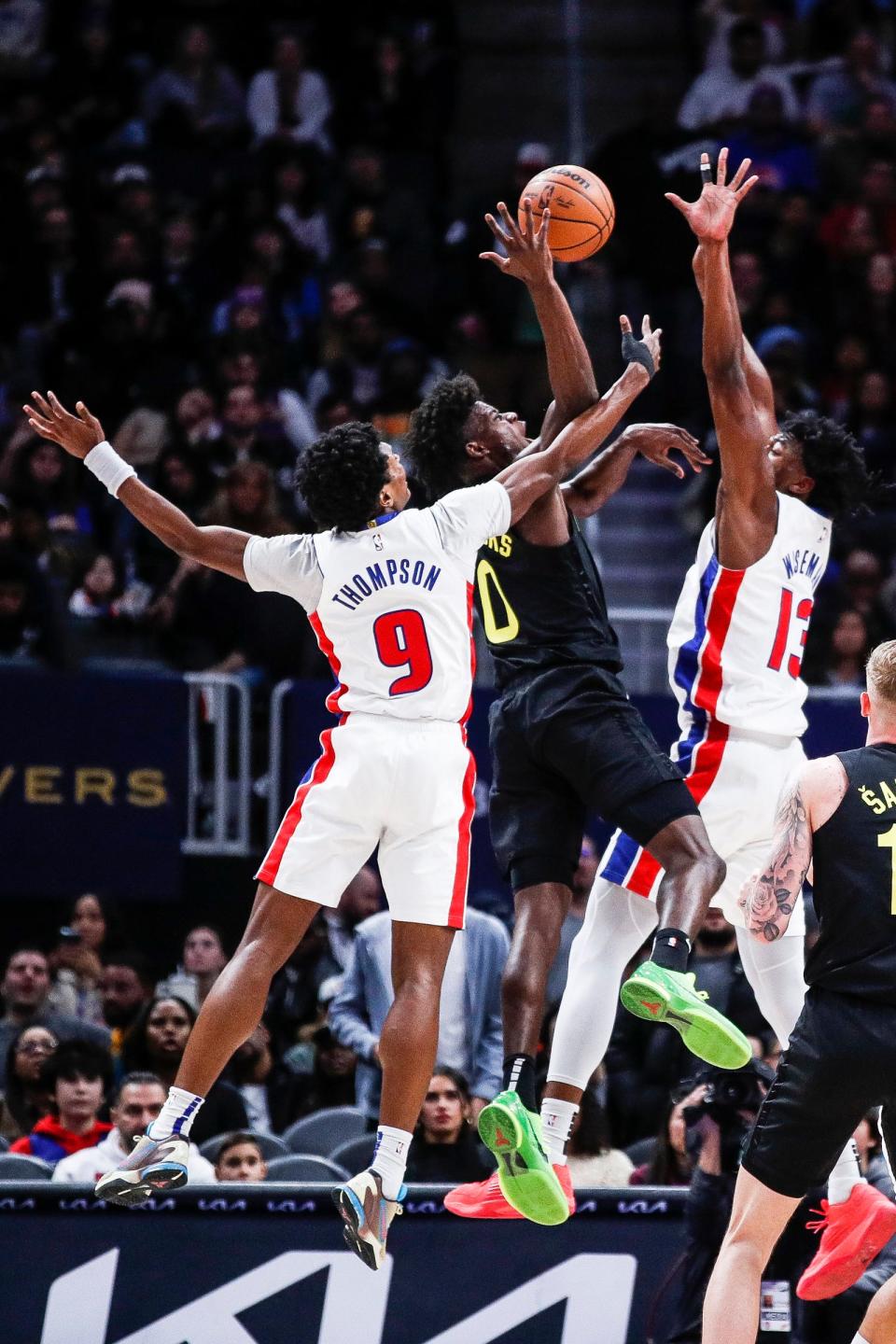 Pistons forward Ausar Thompson and center James Wiseman defend Utah Jazz forward Taylor Hendricks on Thursday, Dec. 21, 2023.