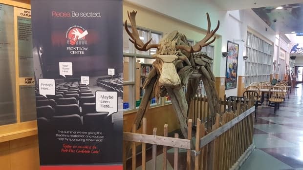 The North Peace Cultural Centre in Fort St. John, B.C., houses an art gallery, performance theatre, library and a lobby housing public art including a driftwood moose named 'Sturgill.' (Andrew Kurjata/CBC - image credit)