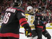 Carolina Hurricaness Vincent Trocheck (16) has a word with Bostons Craig Smith (12) during the first period on Saturday, May 14, 2022 during game seven of the Stanley Cup first round at PNC Arena in Raleigh, N.C.