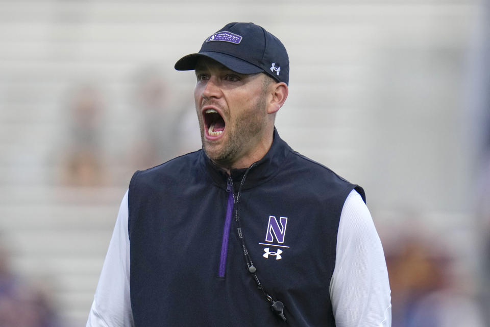 Northwestern interim head coach David Braun shouts to players before an NCAA college football game against Minnesota, Saturday, Sept. 23, 2023, in Evanston, Ill. (AP Photo/Erin Hooley)