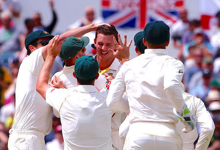 Cricket - Australia v England - Ashes test match - WACA Ground, Perth, Australia, December 17, 2017 - Australia's Josh Hazlewood celebrates with team mates after dismissing England's Alastair Cook during the fourth day of the third Ashes cricket test match. REUTERS/David Gray