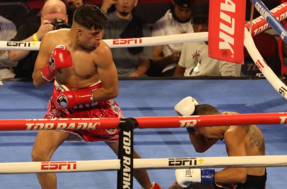Karlos Balderas of Santa María knocks down Brazilian Aelio Mesquita in a lightweight bout in the first round at the Save Mart Center on March 4, 2022.
