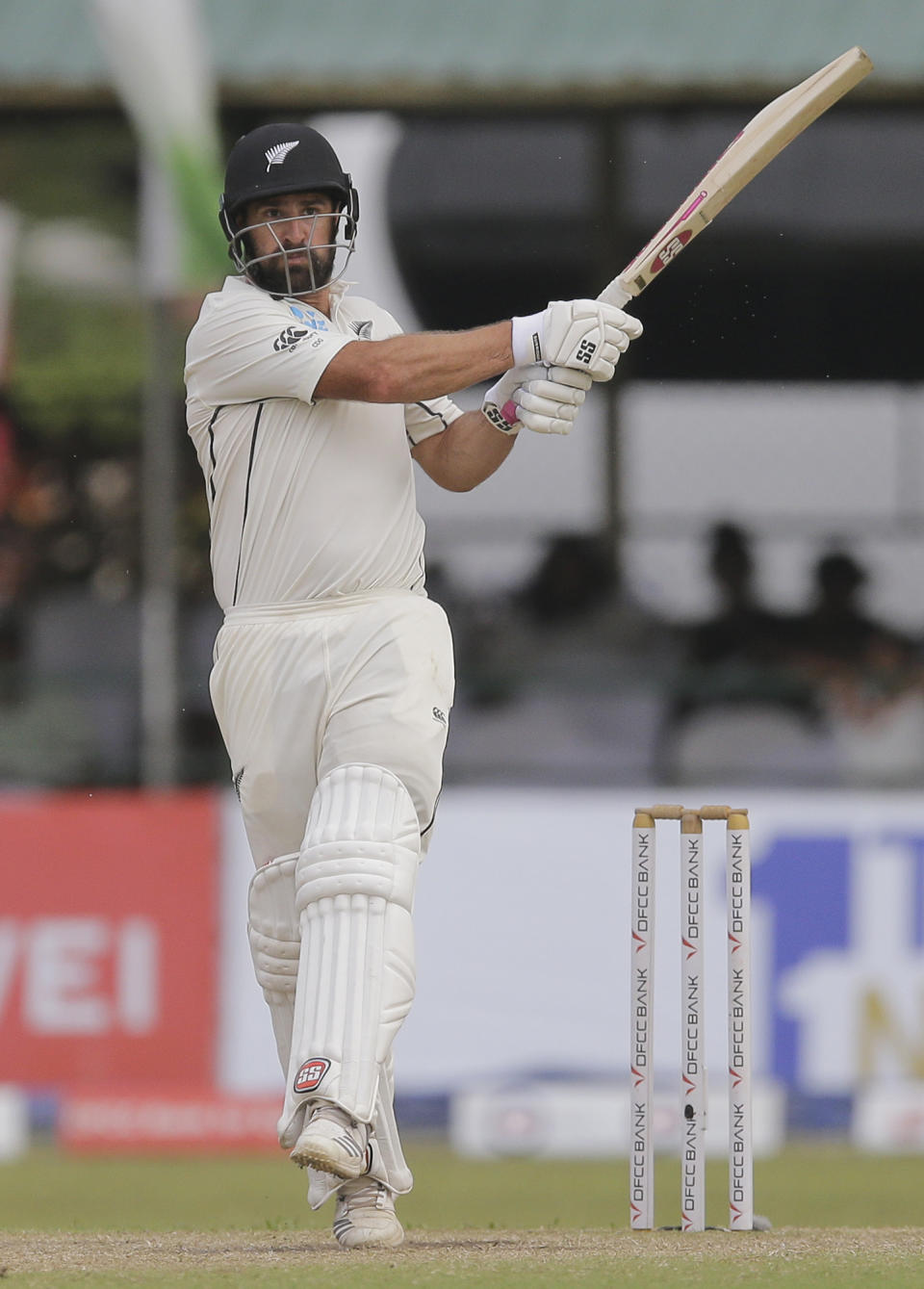 New Zealand's Colin de Grandhomme plays a shot during day four of the second test cricket match between Sri Lanka and New Zealand in Colombo, Sri Lanka, Sunday, Aug. 25, 2019. (AP Photo/Eranga Jayawardena)