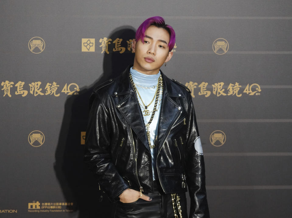 Taiwanese singer ''Ozi'' poses as he arrives for the 31th Golden Melody Awards in Taipei, Taiwan, Saturday, Oct. 3, 2020. The award show, one of the world's biggest Chinese-language pop music annual events was postponed from June to Oct. due to the coronavirus pandemic. (AP Photo/Billy Dai)