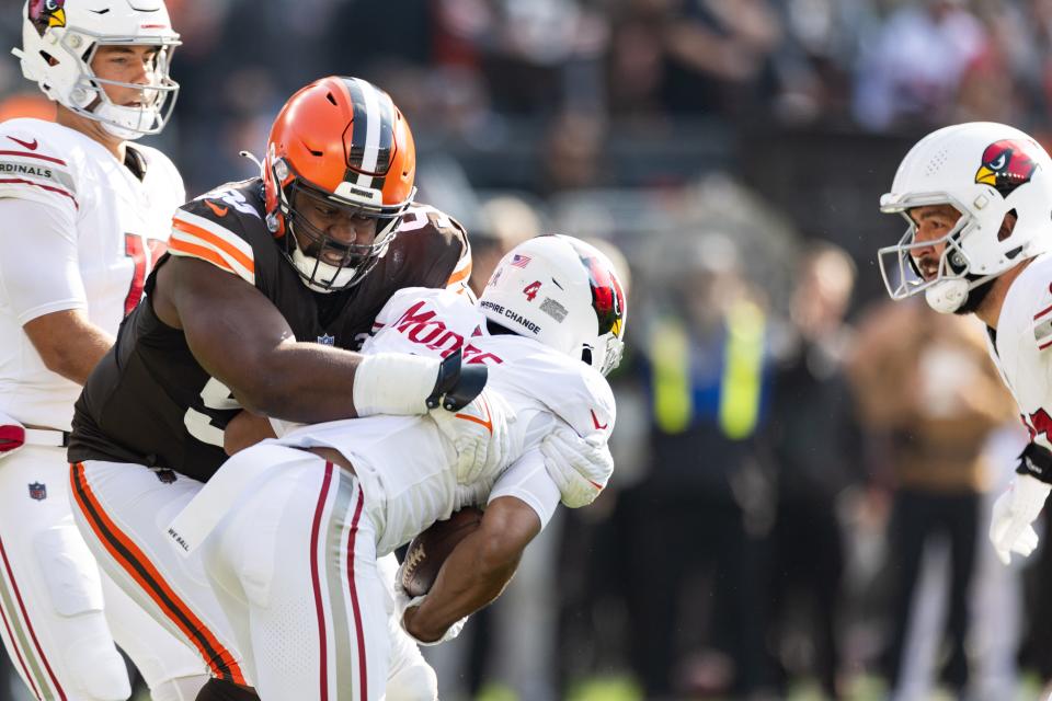 Cleveland Browns defensive tackle Shelby Harris (93) tackles Arizona Cardinals wide receiver Rondale Moore (4) for a loss Sunday in Cleveland.