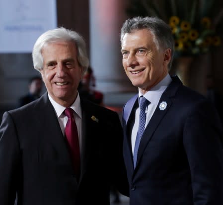 Argentina's President Mauricio Macri and his Uruguayan counterpart Tabare Vazquez pose at the 54th Summit of Heads of State of Mercosur and Associated States, in Santa Fe