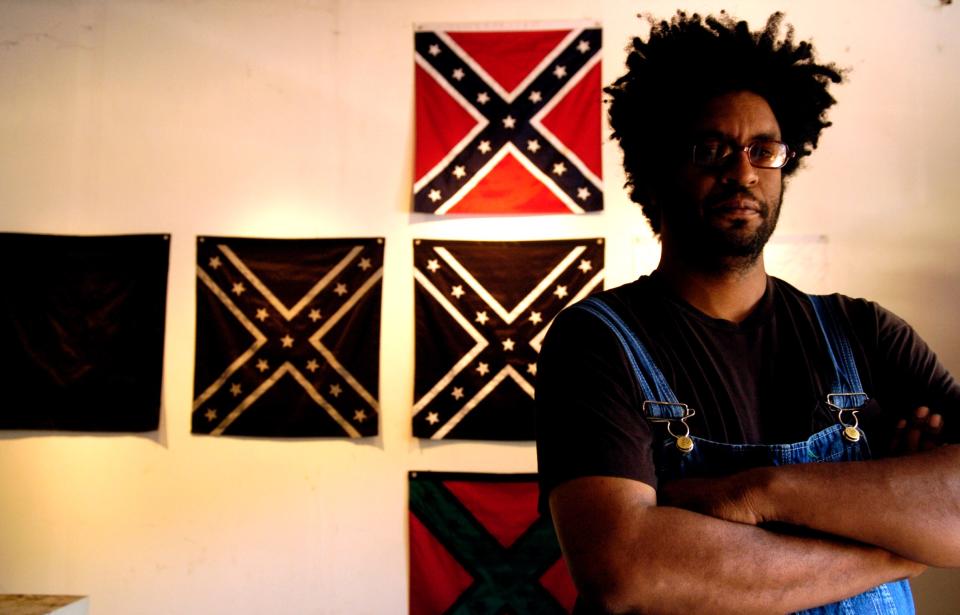 John Sims stood in front of his art piece called Falling Cross which was part of his exhibit which opened at the Ringling Museum on March 31, 2006.