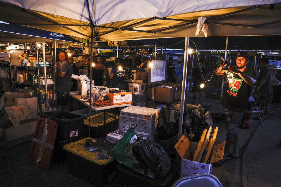 Lahaina, Maui, Monday, August 14, 2023 - A tent on the front yard of Archie Kalepa's home serves as a distribution center of food and supplies for victims of the recent devastating wildfires. (Robert Gauthier / Los Angeles Times via Getty Images)