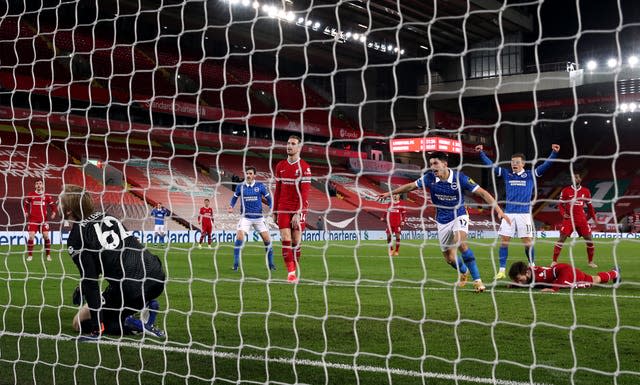 Steven Alzate, centre, scores Brighton's winner against Liverpool