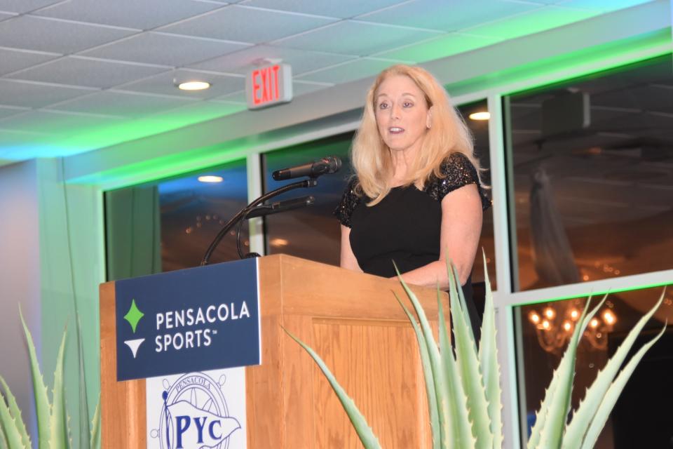 Pensacola resident Jackie Gheen addresses gathering at Thursday's annual Pensacola Sports Awards Banquet at Pensacola Yacht Club after being inducted into the organization's Hall of Fame.