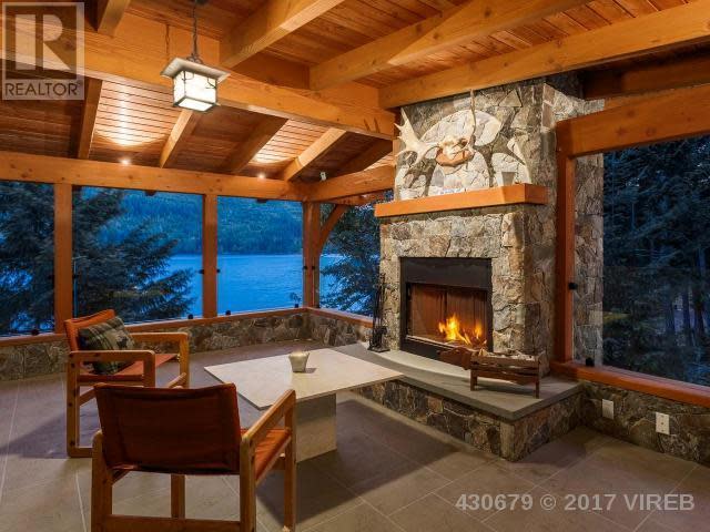 <p><span>3905 #407-3676 Horne Lake Caves Rd., Qualicum Beach, B.C.</span><br> The natural tones used throughout the home will make you feel as if you’re living right in the outdoors. And on the screened-in deck with fireplace, you basically will be!<br> (Photo: Zoocasa) </p>