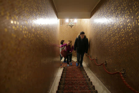 A tour guide leads the way for two Russian tourists during their visit at Romania's former communist dictator Nicolae Ceausescu' villa in Bucharest, Romania January 25, 2017. Inquam Photos/Octav Ganea/via REUTERS