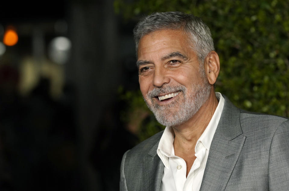 FILE - George Clooney, a cast member in "Ticket to Paradise," poses at the premiere of the film, Monday, Oct. 17, 2022, at the Regency Village Theatre in Los Angeles. Clooney turns 62 on May 6. (AP Photo/Chris Pizzello, File)