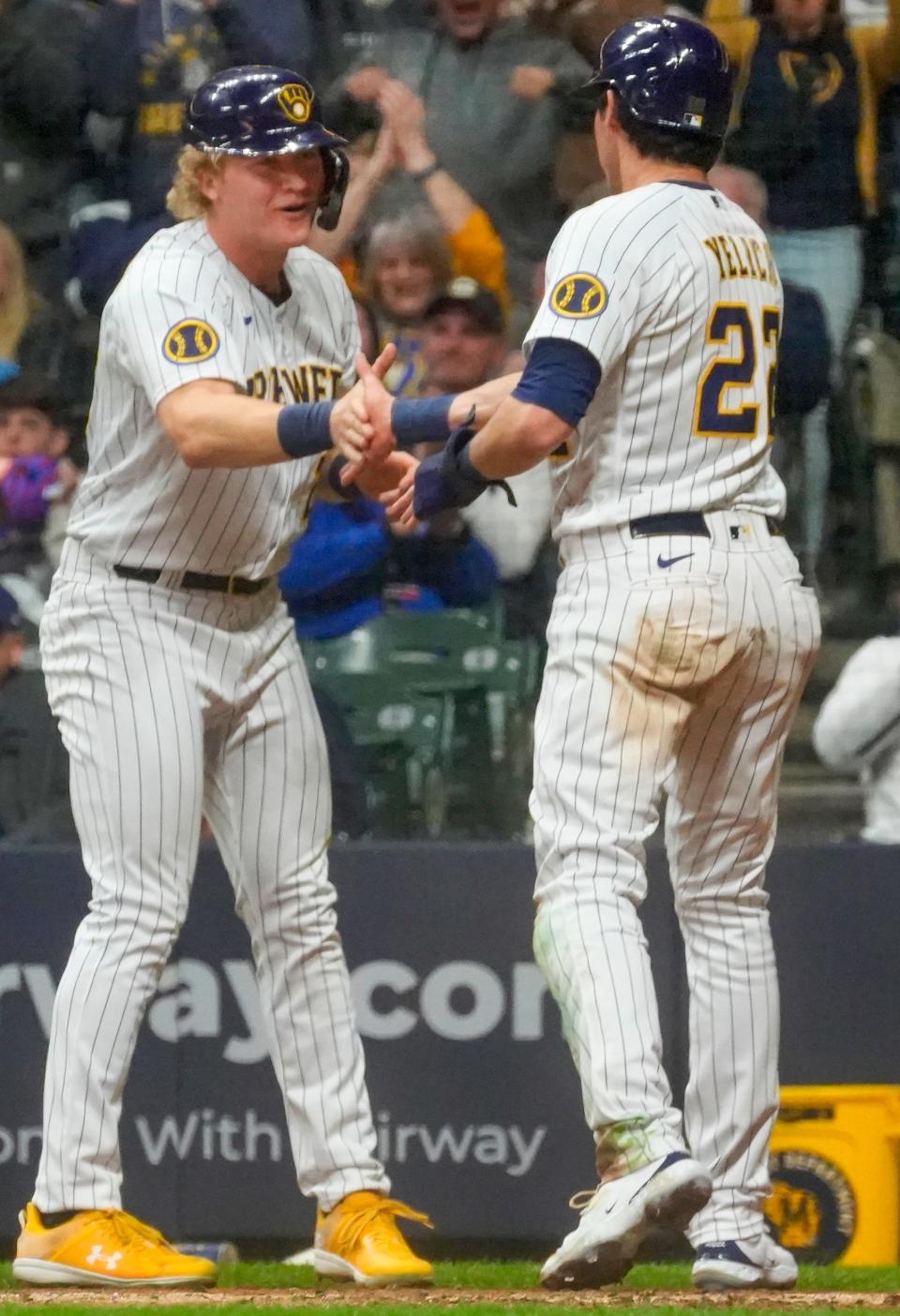 The resurgence of Christian Yelich, right, has been important to the Brewers' success in the first half.