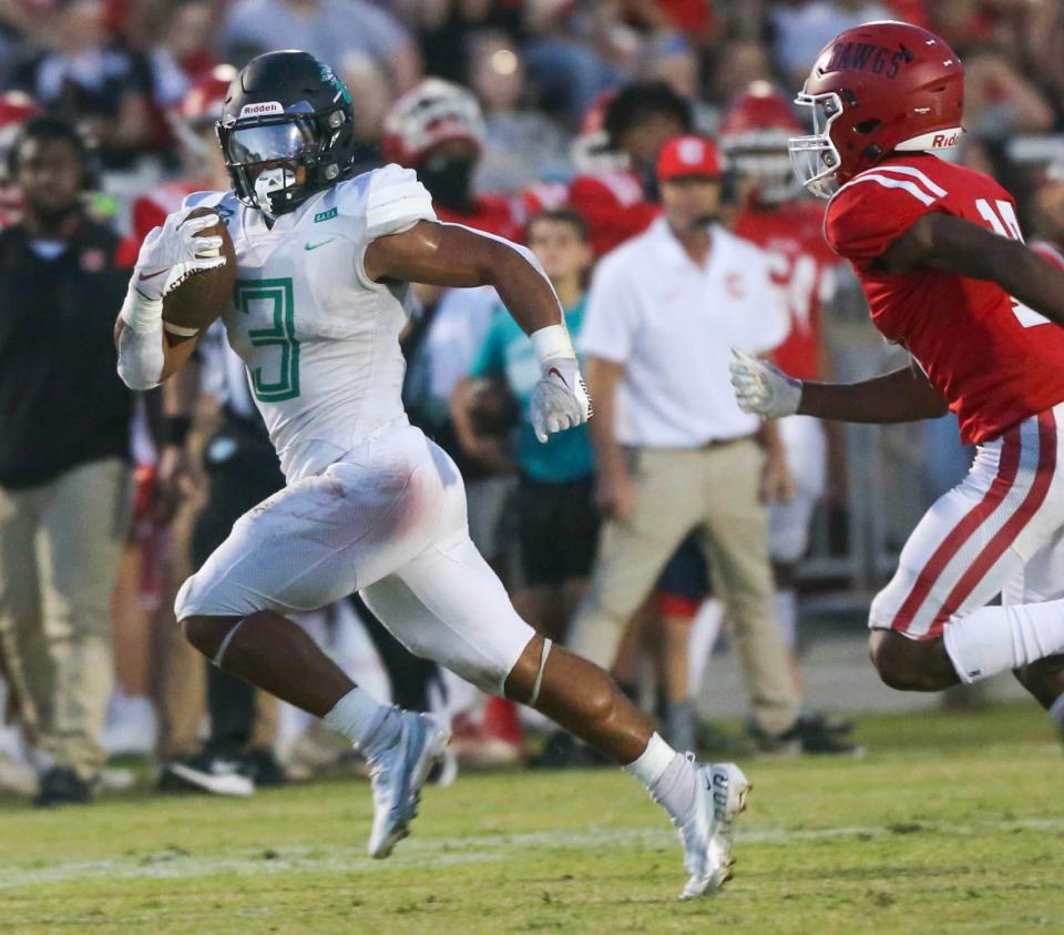 Choctaw RB Cole Tabb breaks away near the sidelines as he carries the ball during the Crestview-Choctaw football game at Crestview. Tabb amassed over 300 rushing yards in the first half alone.