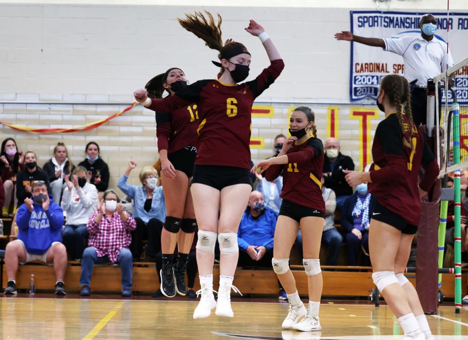 Cardinal Spellman players celebrate an ace during a match versus Hanover on Friday, Nov. 4, 2021.