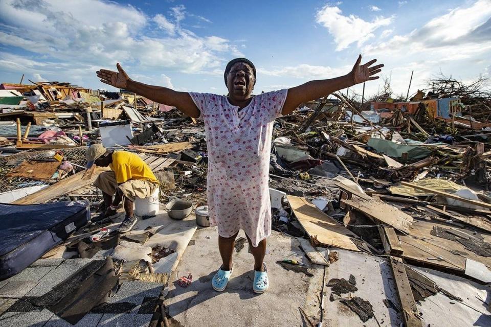 Aliana Alexis of Haiti stands on the concrete slab of what is left of her home after destruction from Hurricane Dorian in an area called “The Mud” at Marsh Harbour in Great Abaco Island, Bahamas on Thursday, September 5, 2019