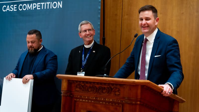 Dr. Paul W. Lambert, right, senior business fellow at the Religious Freedom & Business Foundation, speaks at the Faith and Belief at Work Case Competition at the Hinckley Center at Brigham Young University in Provo on Friday, Feb. 17, 2023. On his left are Father Greg McBrayer and Izzy Rivera.