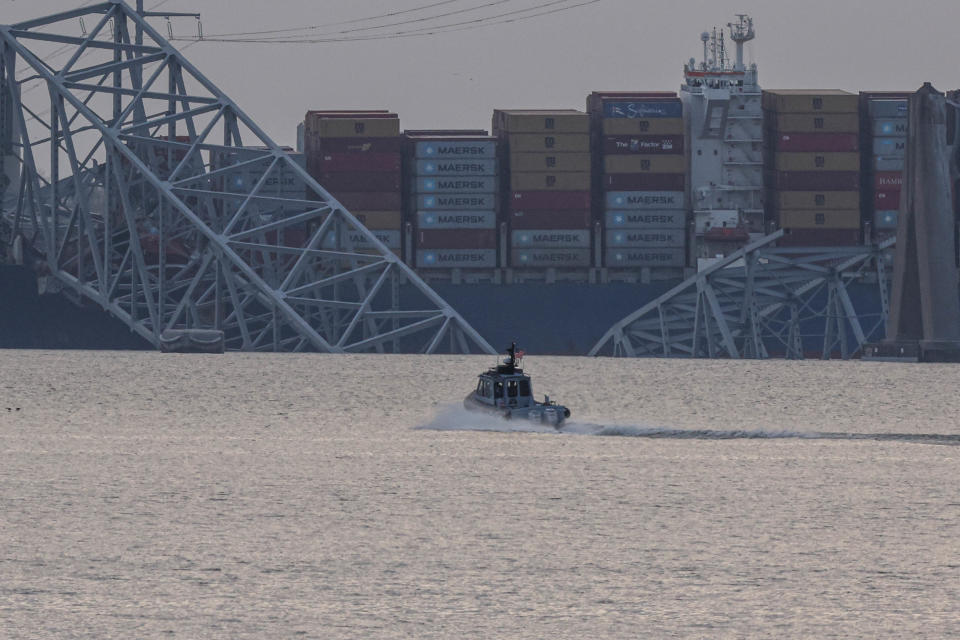 EDGEMERE, MARYLAND - MARCH 26: The collapsed Francis Scott Key Bridge is shown after being struck by a cargo ship on March 26, 2024 in Edgemere, Maryland. Two survivors were been pulled from the Patapsco River and six missing people are presumed dead after the Coast Guard called off search and rescue efforts. A work crew was fixing potholes on the bridge, which is used by roughly 30,000 people each day, when the ship struck at around 1:30 am on Tuesday morning. The accident has temporarily closed the Port of Baltimore, one of the largest and busiest on the East Coast of the U.S.   (Photo by Kena Betancur/Getty Images)