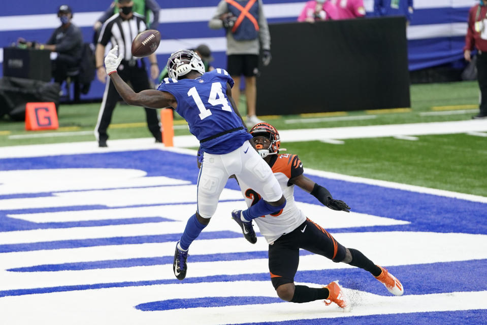Indianapolis Colts' Zach Pascal (14) tries to make a catch while defended by Cincinnati Bengals' Darius Phillips (23) during the first half of an NFL football game, Sunday, Oct. 18, 2020, in Indianapolis. The pass was incomplete. (AP Photo/AJ Mast)