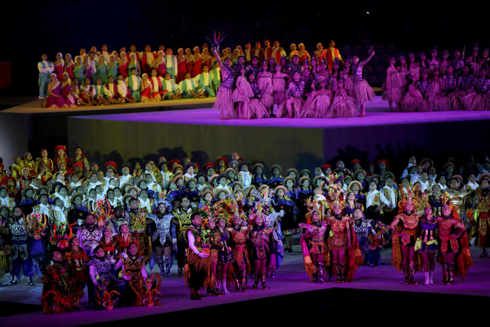 Performers look up during closing ceremony of the Pan American Games at the National stadium in Lima, Peru, Sunday, Aug. 11, 2019. (AP Photo/Rodrigo Abd)