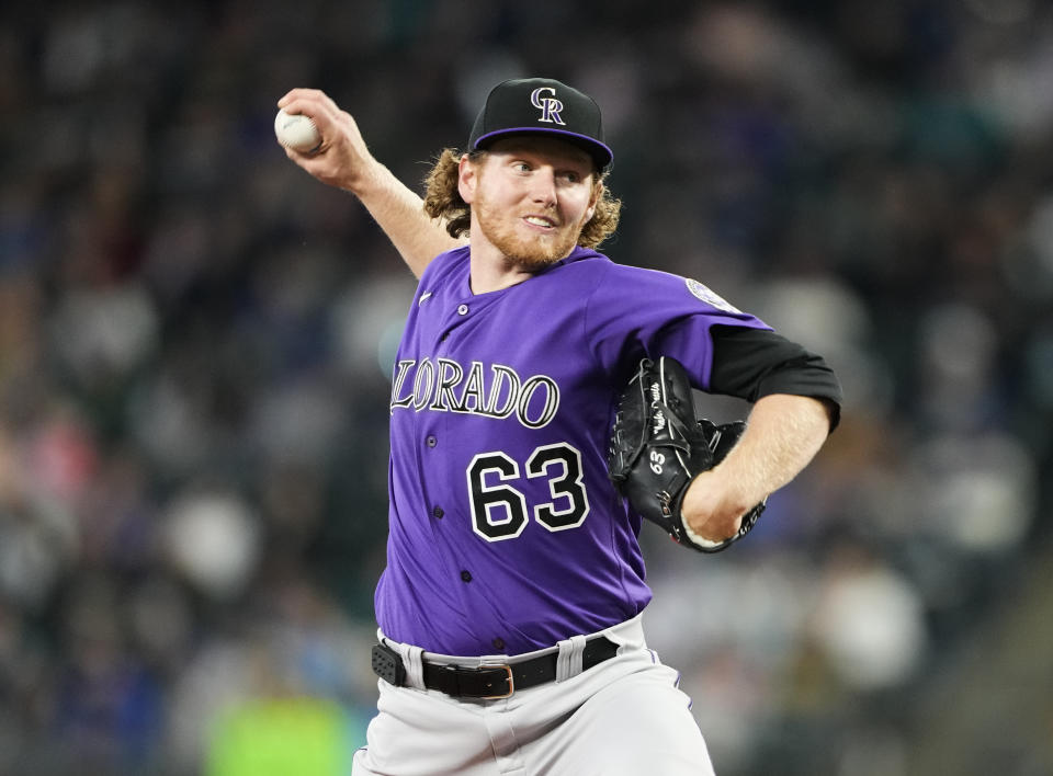 Colorado Rockies starting pitcher Noah Davis throws against the Seattle Mariners during the first inning of a baseball game, Sunday, April 16, 2023, in Seattle. (AP Photo/Lindsey Wasson)