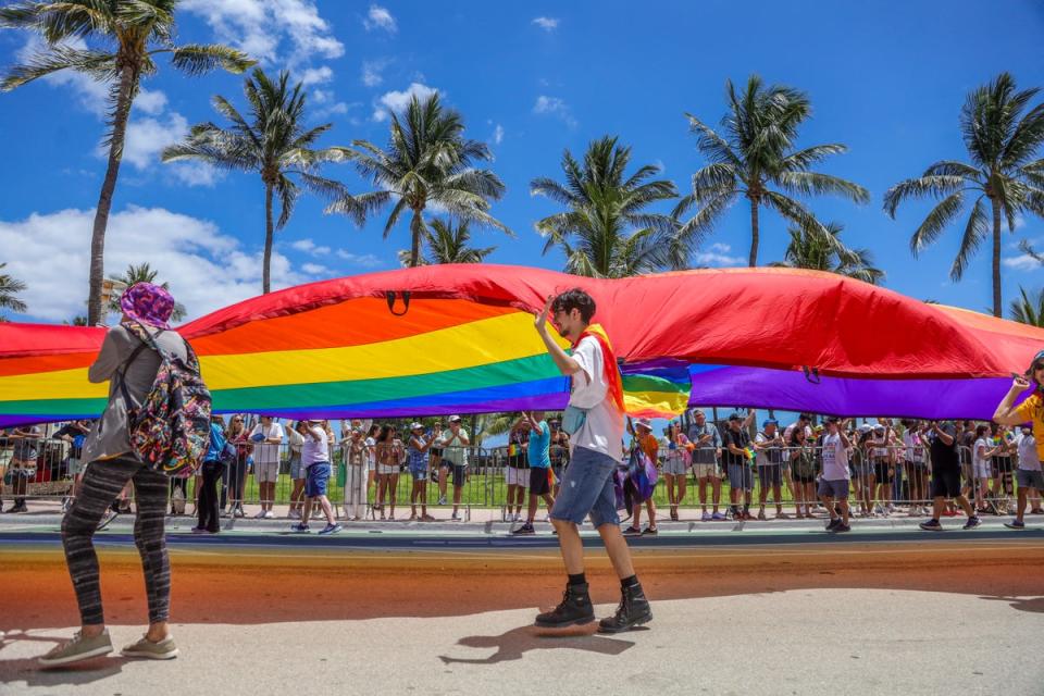 Revelers take part in the Miami Beach Pride Parade on Ocean Drive on April 14, 2024, in Miami Beach, Florida (AFP via Getty Images)