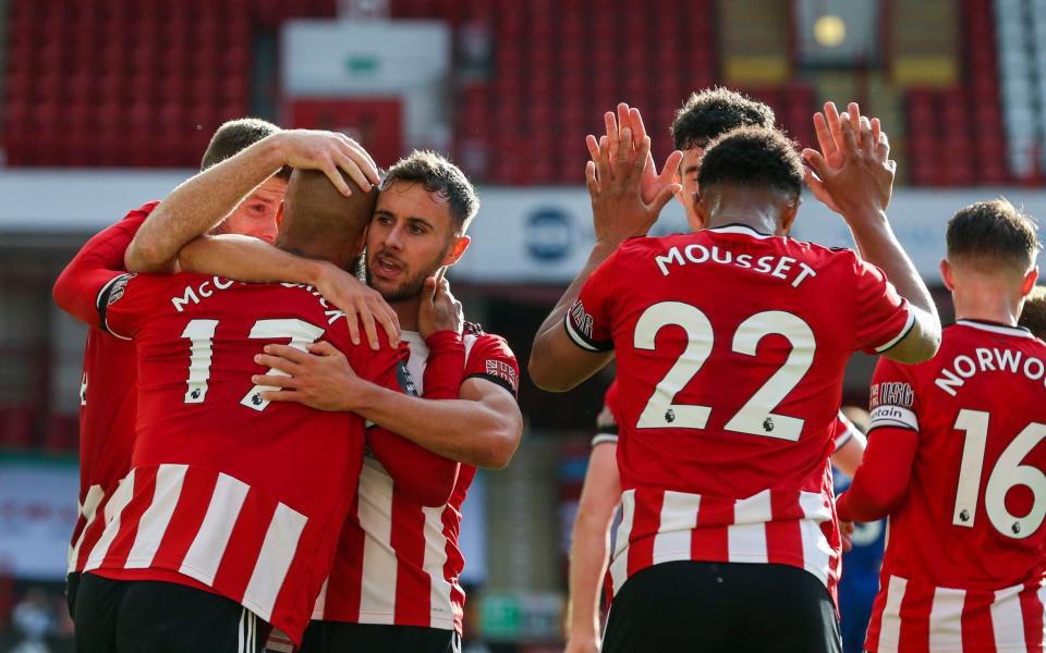 Sheffield United's David McGoldrick celebrates scoring his side's third goal with teammates during the Premier League match between Sheffield United and Chelsea - CameraSport