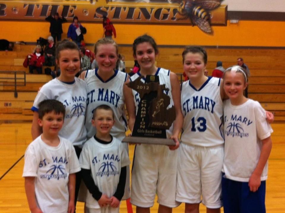 A young Gavin Bebble (bottom left) poses after the St. Mary's girls basketball team won the Division 4 regional final in 2012. His sister Jada played a key role for the Snowbirds.