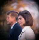 <p>President John F. Kennedy and First Lady Jackie Kennedy on the White House lawn as they witnessed part of the performance of the Black Watch Royal Highland Regiment. The Kennedys had invited 1700 children, from child care agencies, to view the program.<br></p>