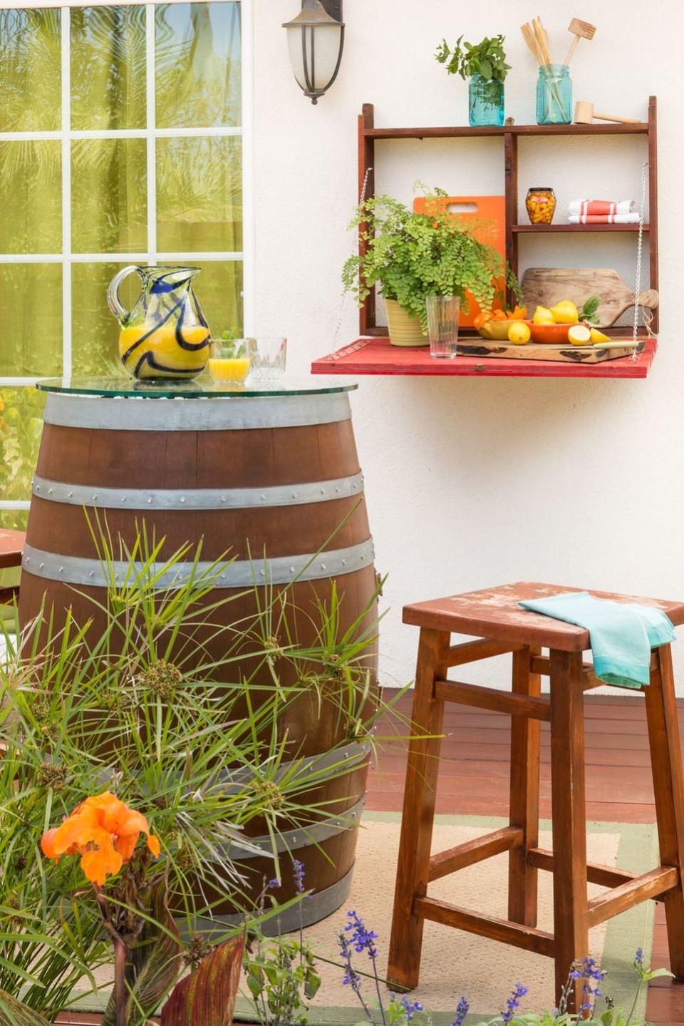 <p>Mount a folding shelf to the exterior of your house, and use it to hold party snacks, drinks or utensils.</p>