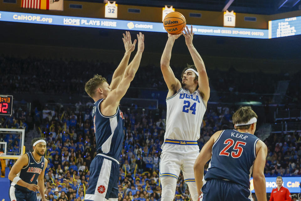 UCLA guard Jaime Jaquez Jr. shoots against Arizona guard Pelle Larsson in their game on Saturday, March 4, 2023, in Los Angeles. 