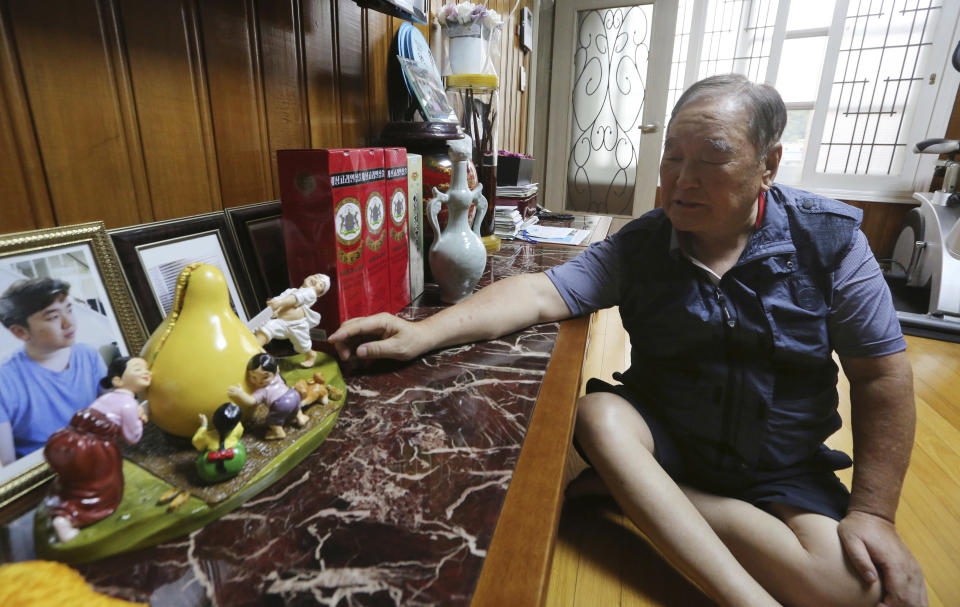 In this Aug. 23, 2018, photo, Ham Sung-chan, 93, watches gifts he received from his North Koran brother Ham Dong Chan during an interview at his house in Dongducheon, South Korea. After nearly 70 years of a separation forced by a devastating 1950-53 war that killed and injured millions and cemented the division of the Korean Peninsula into North and South, Ham and his North Korean brother only got a total of 12 hours together. (AP Photo/Ahn Young-joon)