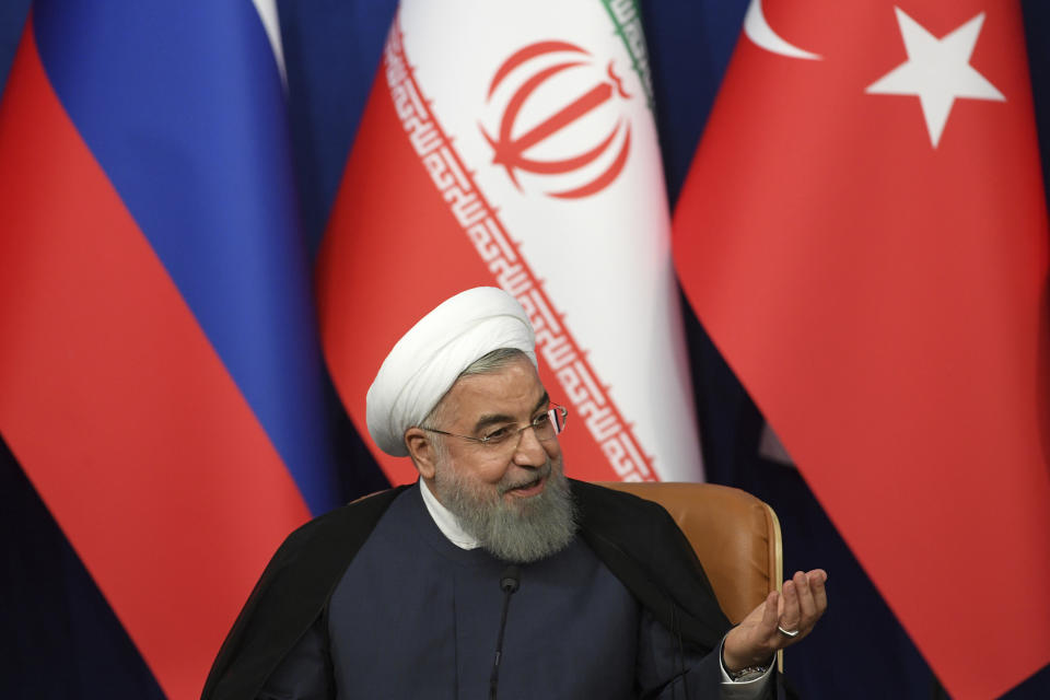 Iran's President Hassan Rouhani attends a news conference following the Russia-Iran-Turkey summit in Iran on Friday Sept. 7, 2018. Putin, Erdogan and Iran's President Hassan Rouhani began a meeting Friday in Tehran to discuss the war in Syria, with all eyes on a possible military offensive to retake the last rebel-held bastion of Idlib. (Kirill Kudryavtsev/Pool Photo via AP)
