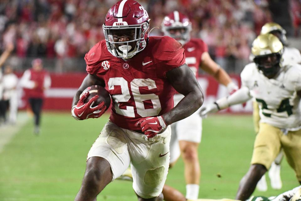 Sep 7, 2024; Tuscaloosa, Alabama, USA; Alabama Crimson Tide running back Jam Miller (26) scores on a 54-yard touchdown run against the South Florida Bulls at Bryant-Denny Stadium. Alabama won 42-16. Mandatory Credit: Gary Cosby Jr.-Imagn Images