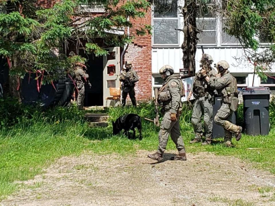 RCMP officers raided a house southwest of Quebec City in connection with a 'national security operation' targeting the neo-Nazi group the Atomwaffen Division. (Submitted by the RCMP - image credit)